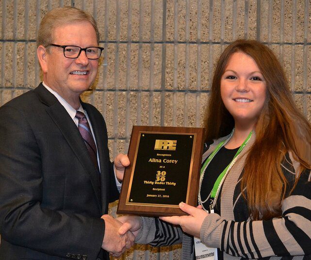 woman receiving award