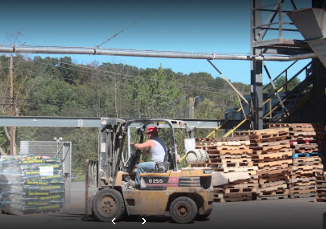 transporting bags of Nature's Best Organic Feeds