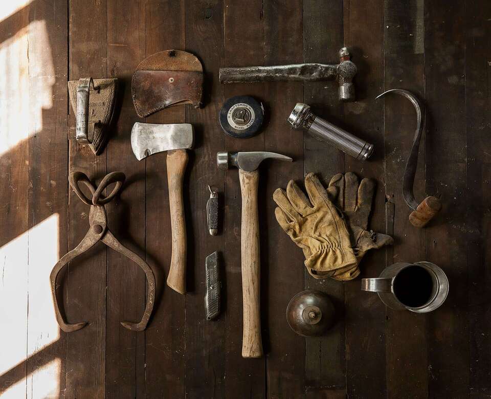 maintenance tools laying on wooden table