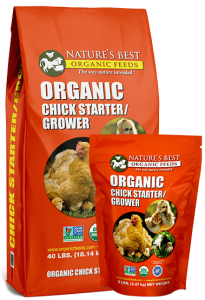 2 orange bags of organic chick starter and grower crumbles