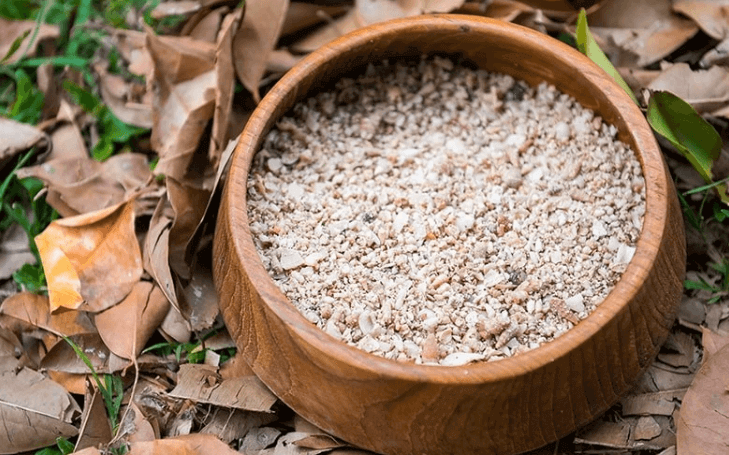 chicken grit in wooden bowl